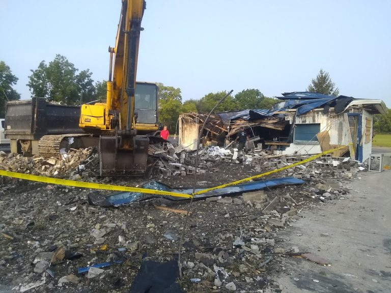 Demolition work area with yellow caution tape