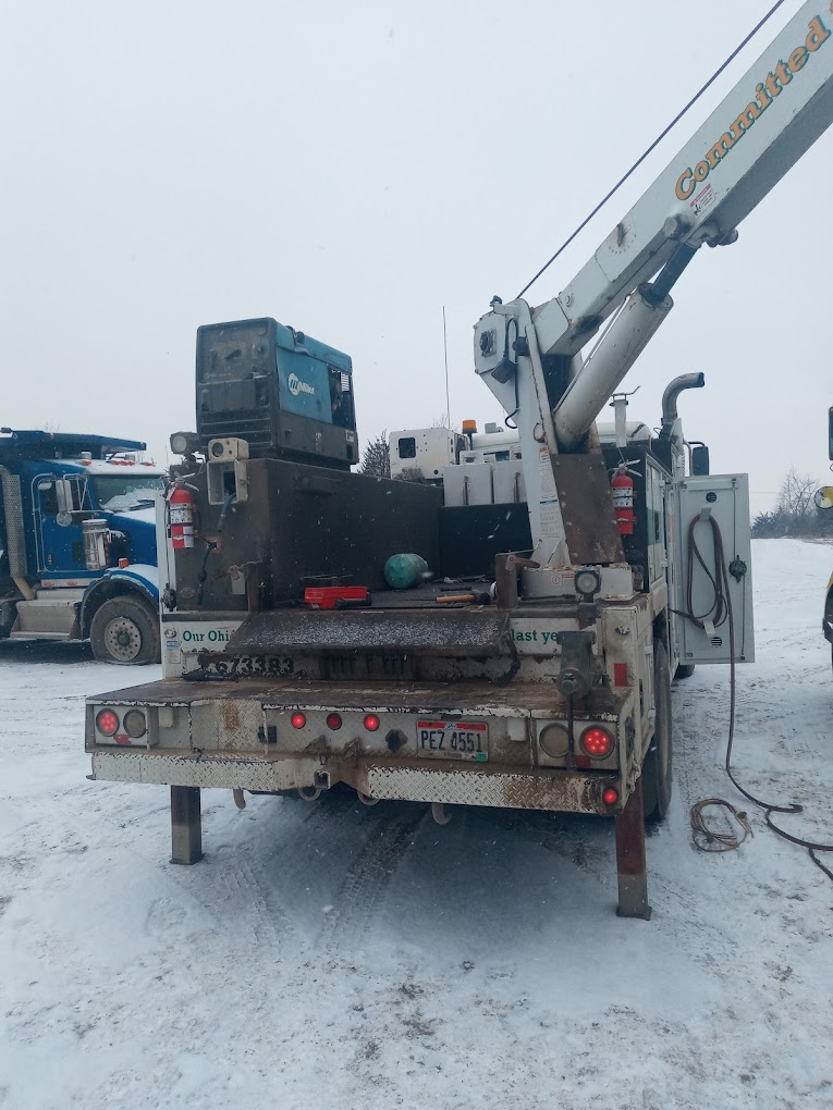 Service truck with crane in the snow