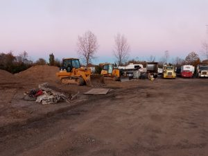 Heavy equipment and trucks at the work yard